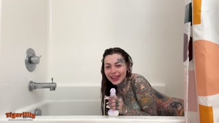Tattooed MILF with big tits &amp; split tongue masturbating in shower until she squirts